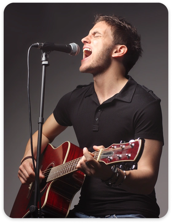 Man Singing Playing Guitar